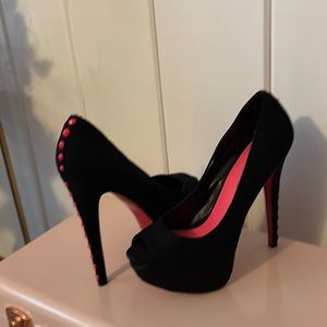 Black and bright pink pumps with studs